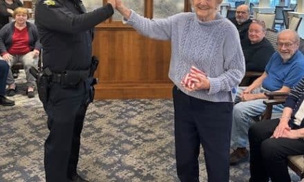 GAME ON! Friendly cornhole toss pits cops vs. retirees