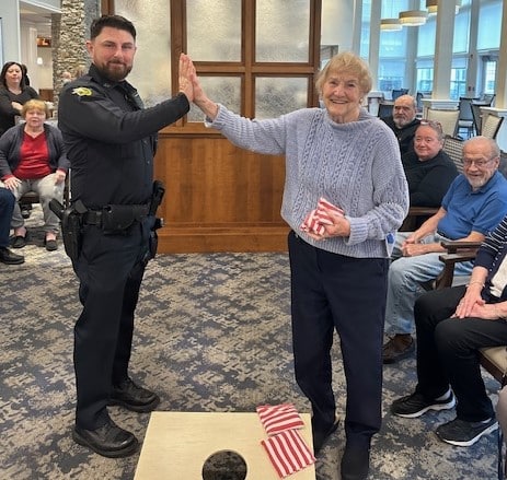 GAME ON! Friendly cornhole toss pits cops vs. retirees