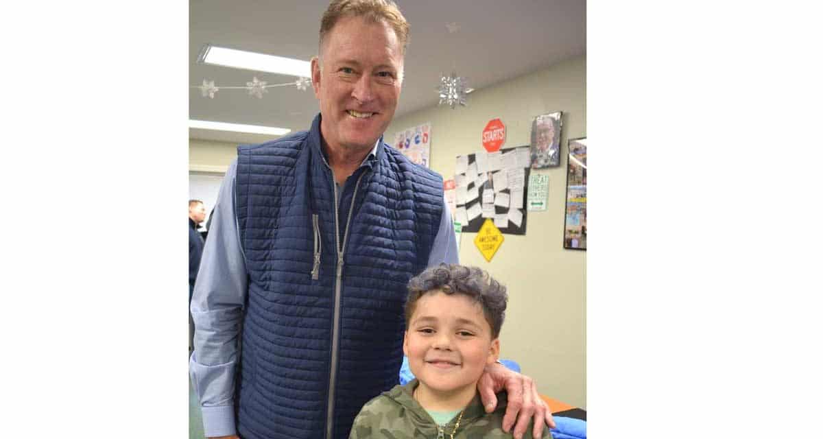 Bruins & firefighters fit 50 kids with new winter coats