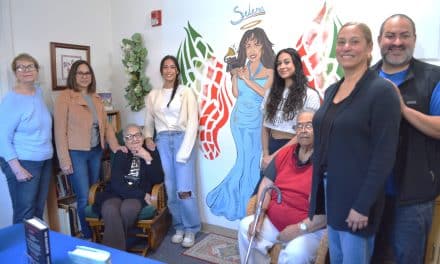 Teen’s mural unveiled at Housing’s renovated library