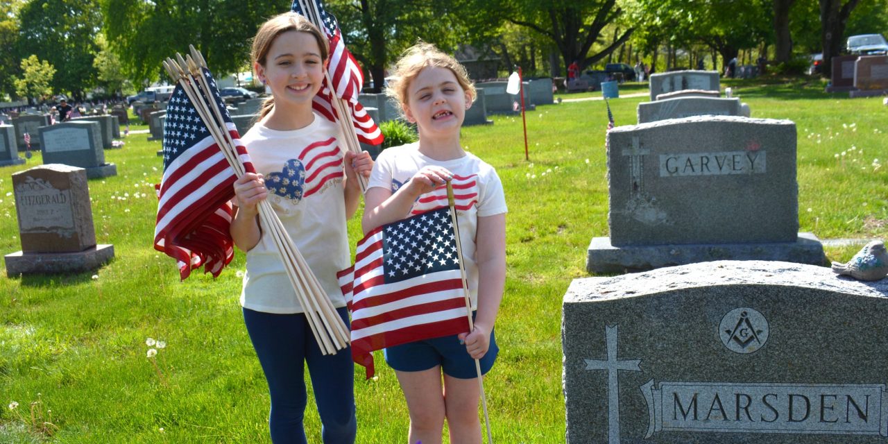 Volunteers replace nearly 6,000 flags at vets’ graves