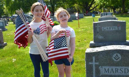 Volunteers replace nearly 6,000 flags at vets’ graves